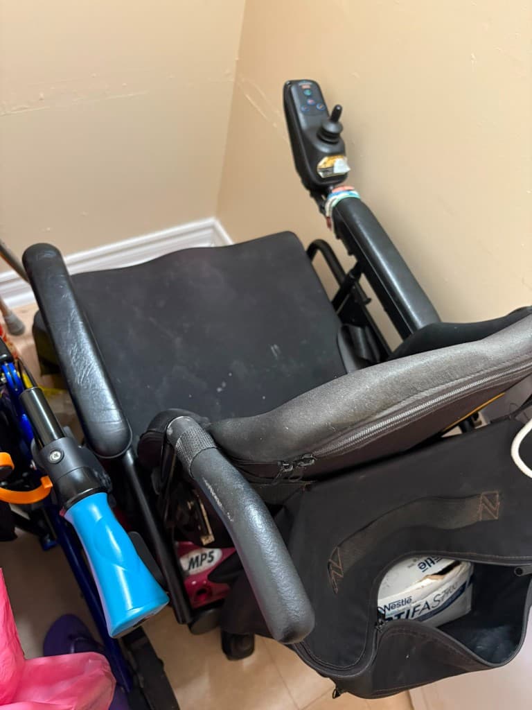 Power wheelchair removal in Toronto — Junk 'Of' Urs hauling heavy medical mobility equipment